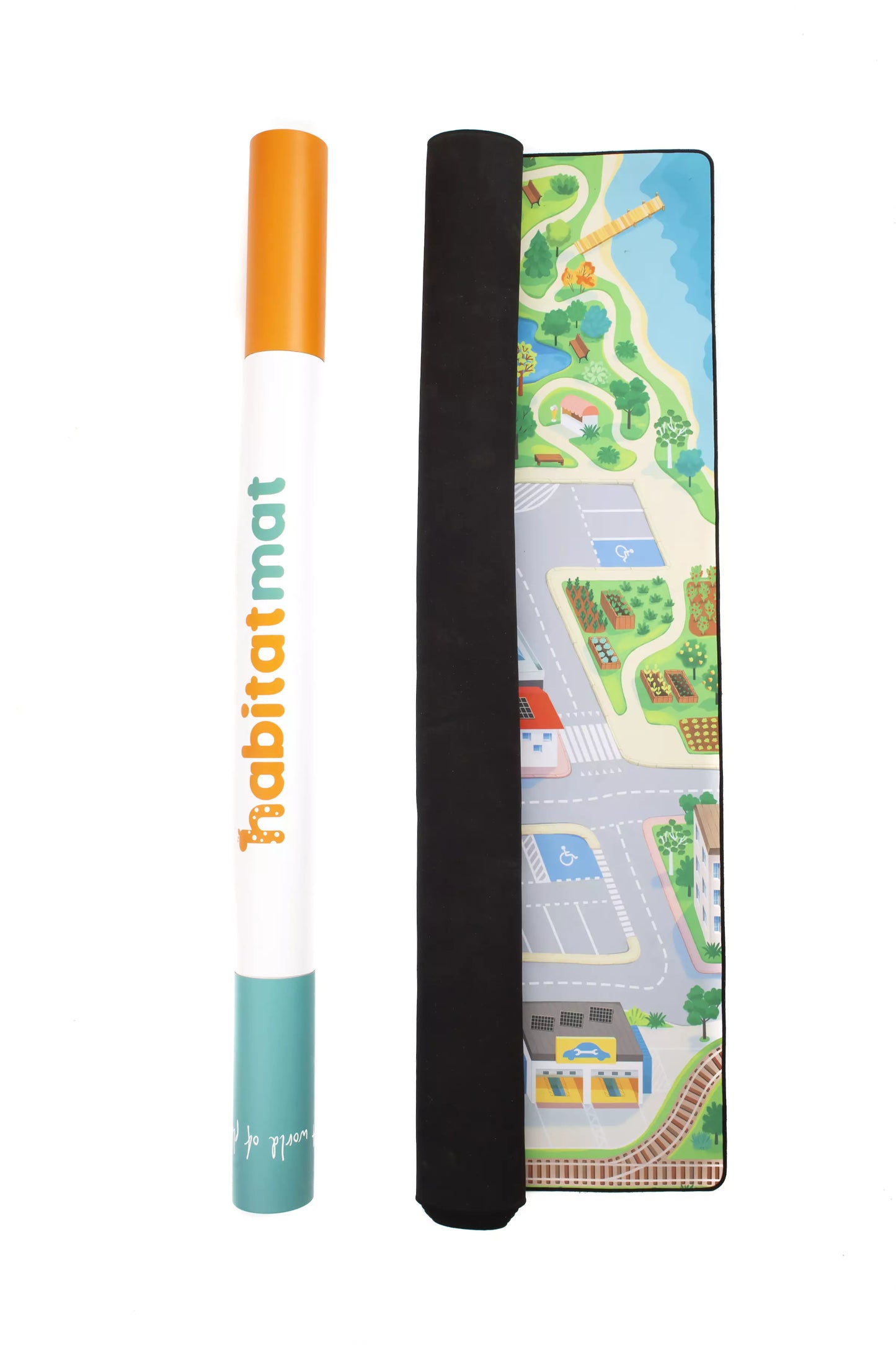 A rolled play mat on the left stands vertically, displaying the brand name "Habitat Mat." Next to it lies "The Community" town play mat, which focuses on sustainability and features a vibrant layout of roads, parking lots, and buildings on a black backing—ideal for imaginative play.